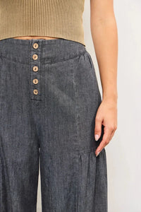 Dark gray high-waisted tiered wide pants with button front and pleats