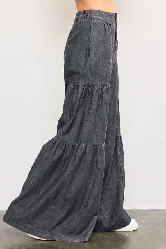 Dark gray denim tiered wide pants with ruffles and elastic waistband