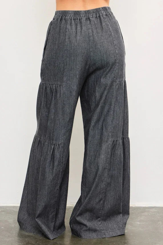 Dark gray denim tiered wide pants with elastic waistband and ruffles