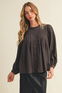 Dark gray long-sleeved blouse featuring a pintuck bib ruffle collar and pleated front for elegant wear