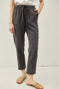Dark gray relaxed-fit cotton tencel tapered pants with elastic waistband and drawstring for comfort and style