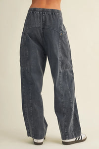 Dark gray wide leg utility denim pants with drawstring waist and multiple patch pockets for a relaxed fit