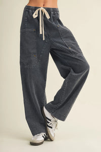 Dark gray drawstring waist wide leg utility cargo pants with multiple pockets for versatile wear