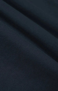 Dark navy blue harbor modal tee fabric with smooth, slightly textured surface and soft folds in modal material