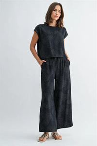 Dark navy blue paisley printed elastic waist pants with matching short-sleeved top featuring subtle paisley pattern