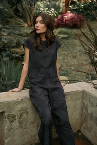 Dark navy blue two-piece outfit featuring a paisley printed wide shoulder top with a subtle paisley pattern