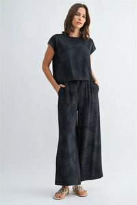 Dark navy blue short-sleeved top with subtle embroidered paisley printed wide shoulder design