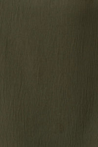 Dark olive-green textured short roll up sleeve top with subtle grain pattern from shop daisy women’s boho chic clothing