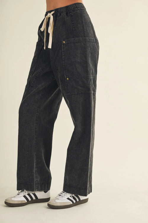 Dark-wash denim drawstring waist wide leg utility pants with gold-tone hardware and cargo pockets