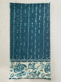 Deep teal hand-dyed boho bandeau headband with shibori stripe indigo pattern and white dotted floral border