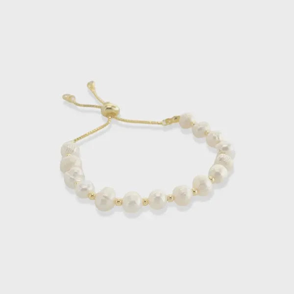 Genuine pearl drawstring bracelet featuring irregular white pearls on a gold-toned adjustable cord with metal clasps