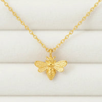 Mini bee gold pendant necklace with detailed wings on dainty chain