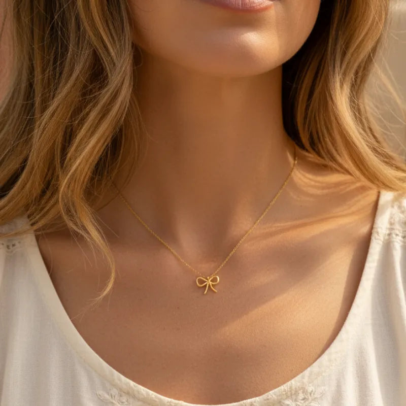Delicate gold dipped wire ribbon bow pendant necklace with fine chain