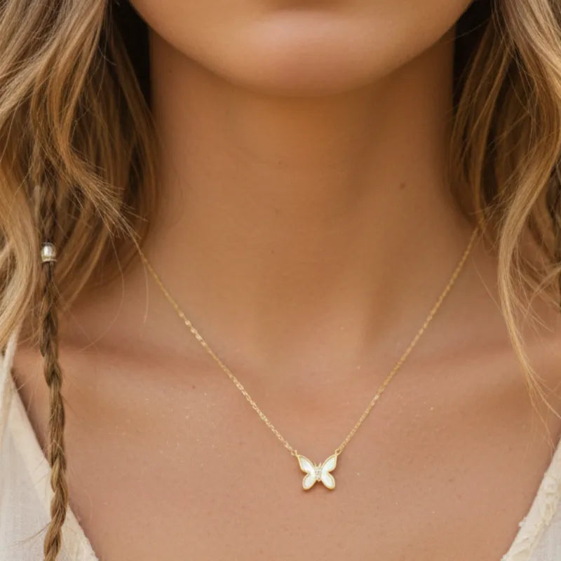 Gold dipped mini butterfly pendant necklace with shimmering clear stones