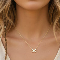 Gold dipped mini butterfly pendant necklace with shimmering clear stones