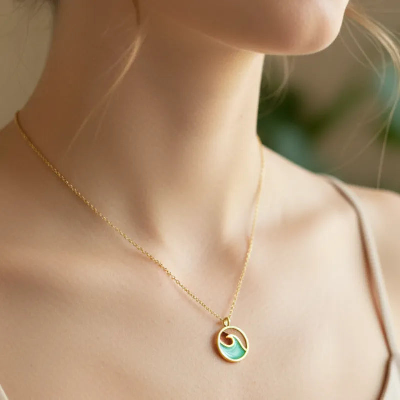 Delicate wave coin gold pendant necklace with turquoise enamel design