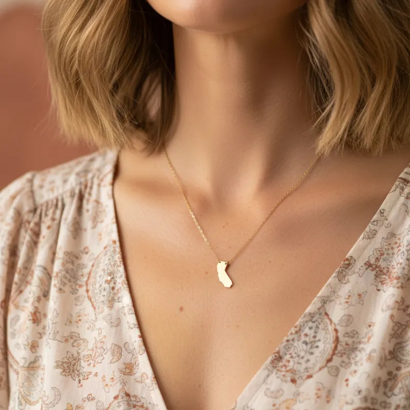 Delicate gold California state pendant necklace with minimalist design