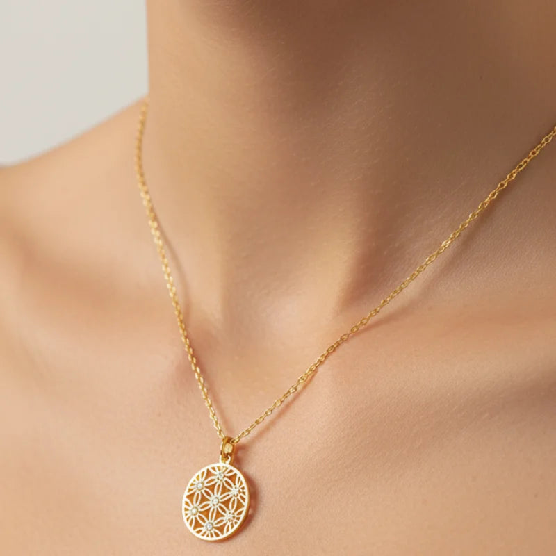 Delicate gold flower coin pendant necklace with geometric pattern and stones