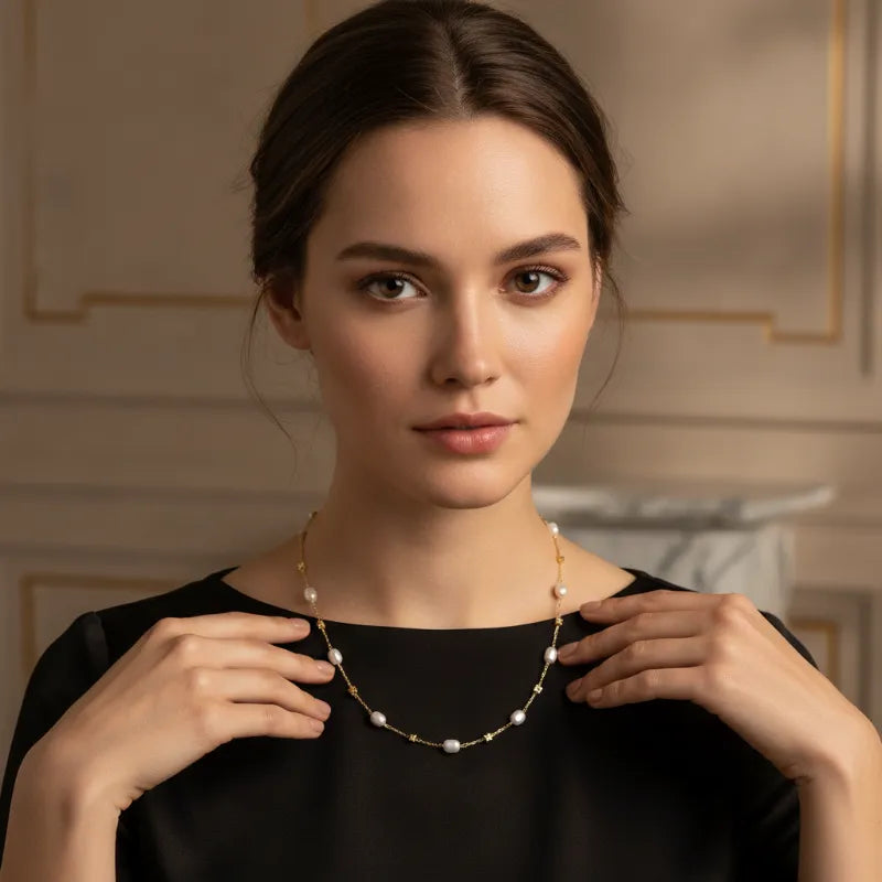 A delicate white pearl gold cube necklace with lustrous pearls and small diamond accents in gold
