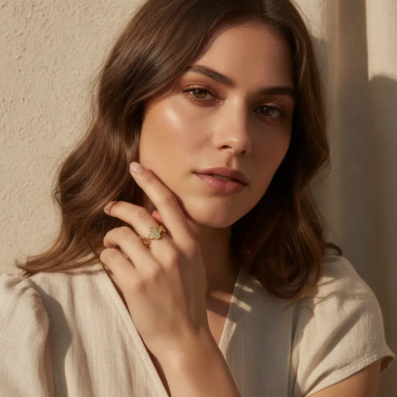 Dazzling crystal pave lucky clover ring in gold featuring a delicate four-leaf clover design with sparkling stones