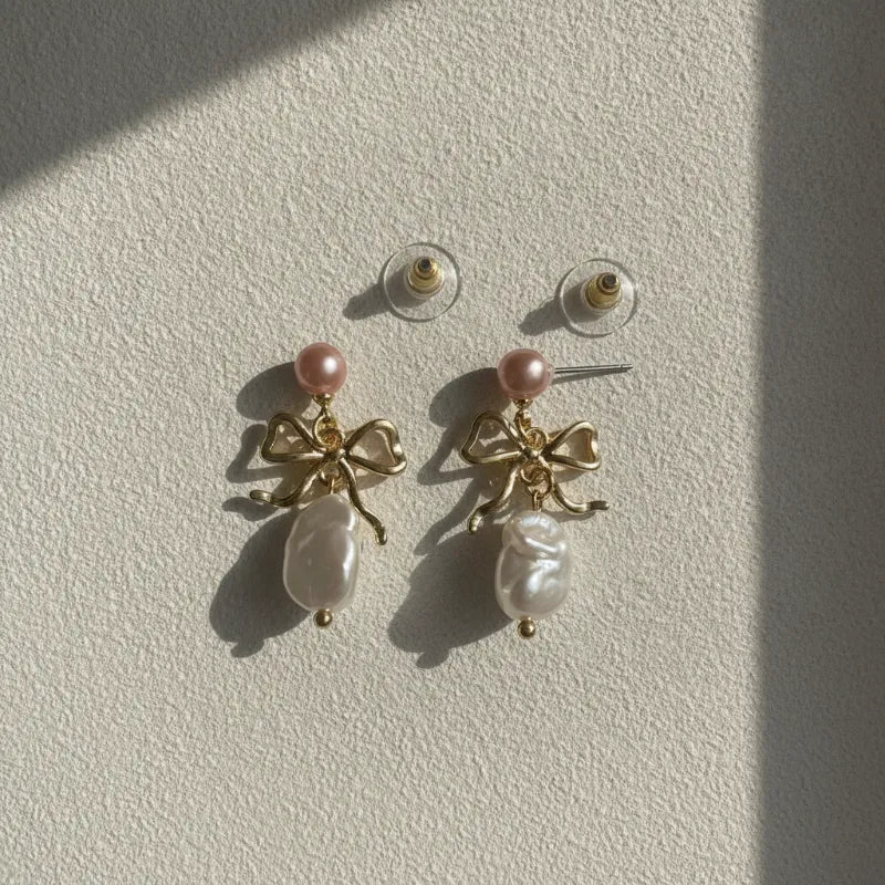Delicate chic gold bow earrings with pink and freshwater style baroque white pearls for elegant wear