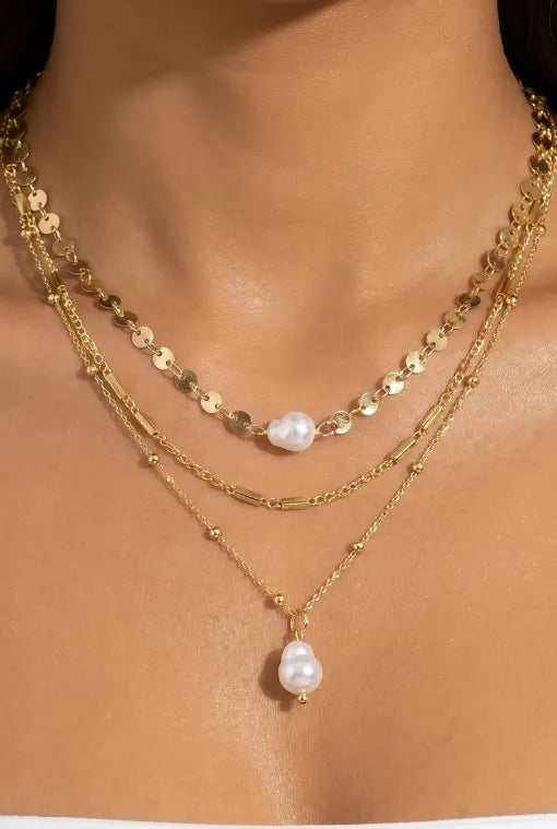 Delicate gold-toned 3 strand mixed chain pearl drop necklace with freshwater pearl pendant and disc charms