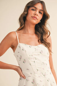 Off-white floral twill paneled midi dress with thin spaghetti straps and fitted bodice ideal for summer wear