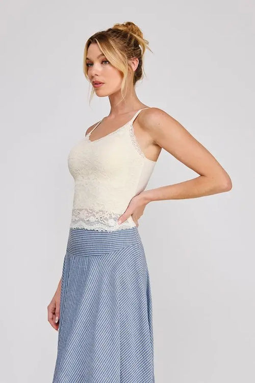 Delicate off-white adjustable strap floral lace bralette camisole with thin spaghetti straps and scalloped hemline