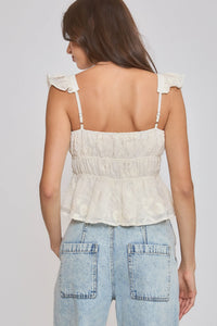Off-white delicate lace embroidered ruffle sleeve blouse with ruffled shoulder straps and peplum-style hem
