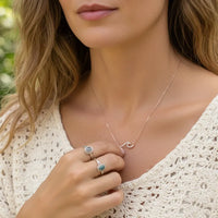 Rose gold dipped pave wave pendant necklace with sparkling stones