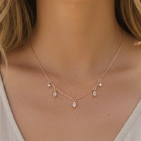Delicate rose gold rhinestone station necklace with marquise-cut gems