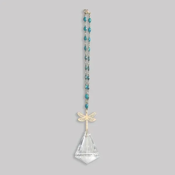 A delicate teal beaded pocket suncatcher with a gold dragonfly pendant and clear crystal teardrop from shop daisy