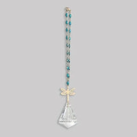 A delicate teal beaded pocket suncatcher with a gold dragonfly pendant and clear crystal teardrop from shop daisy