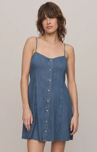 Angel eyes denim mini dress in blue featuring thin straps and front button closure for a stylish look