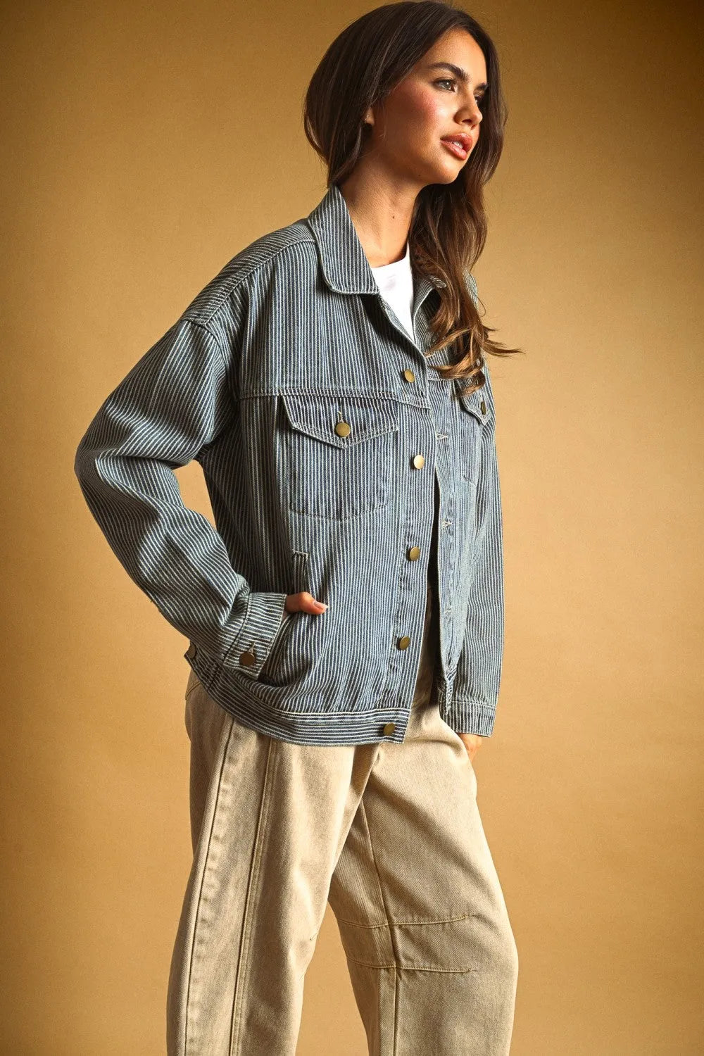 Striped pattern denim jacket in faded blue wash with vertical pinstripes gold buttons and front flap pockets
