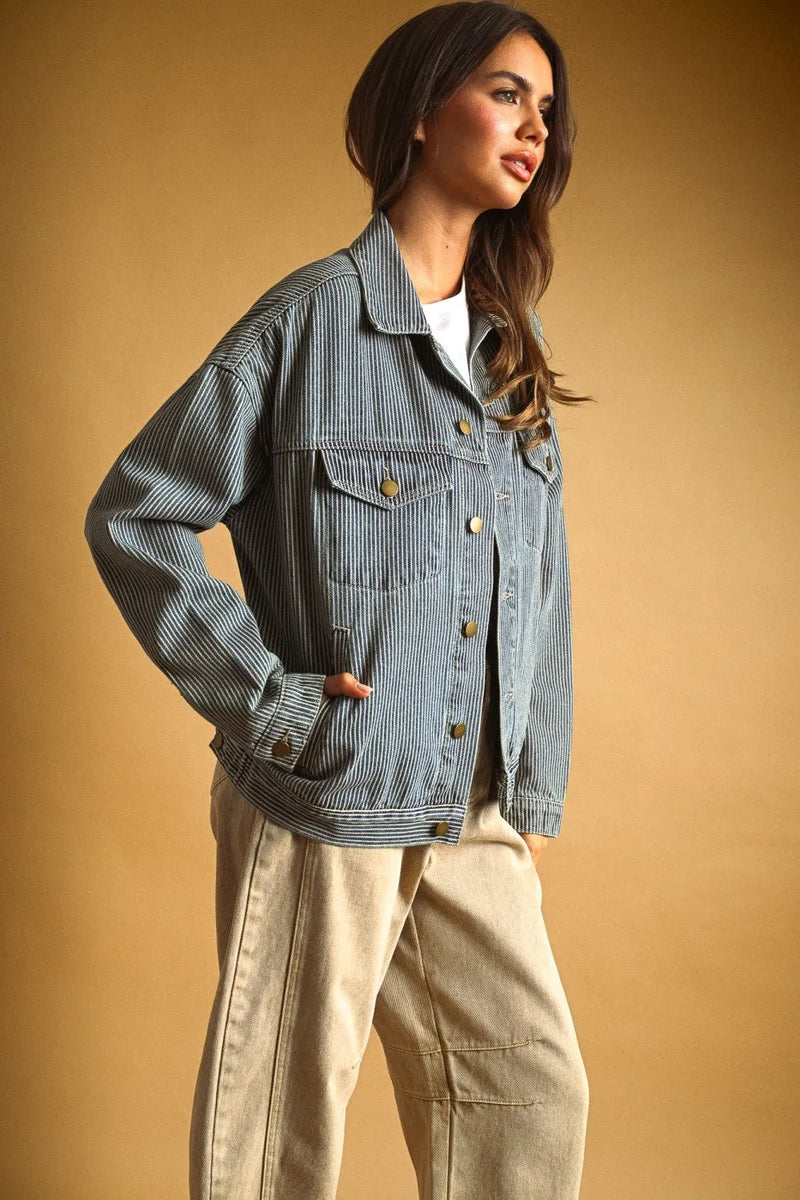 Striped pattern denim jacket in faded blue wash with vertical pinstripes gold buttons and front flap pockets