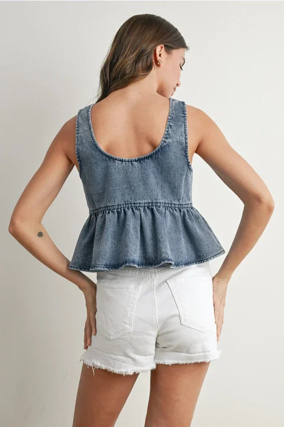 Ruffled hem tie-front denim top with faded blue wash and frayed hem