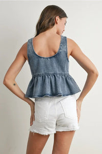 Ruffled hem tie-front denim top with faded blue wash and frayed hem