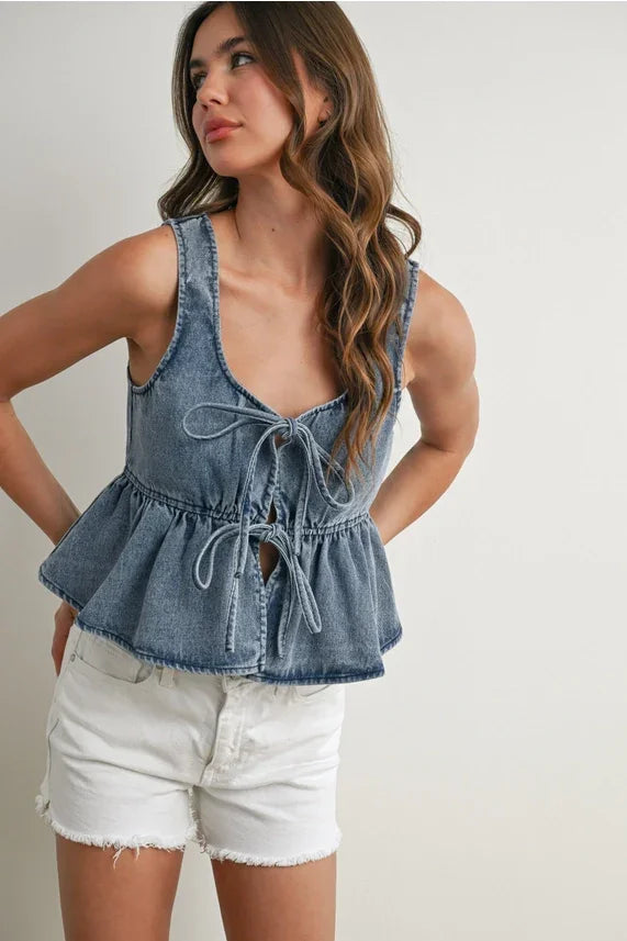 Ruffled hem tie-front denim top with peplum hem and front tie details
