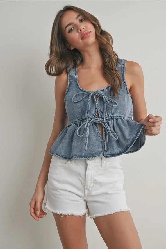 Ruffled hem tie-front top in denim with peplum hem and front tie details