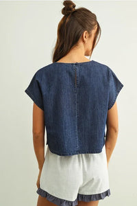 Denim mixed fabric flag patched dolman sleeve top in blue with short sleeves and a back zipper closure visible