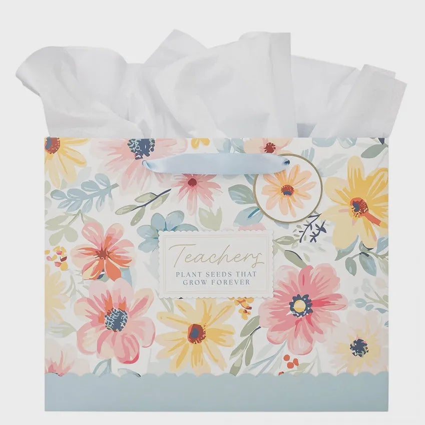 Floral patterned landscape gift bag with pastel flowers and teachers plant seeds text in elegant script on white background