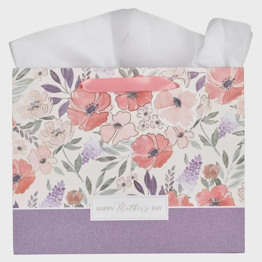 Happy mothers day landscape gift bag with floral pattern, pink handle, and pastel blossoms for mothers day gifting