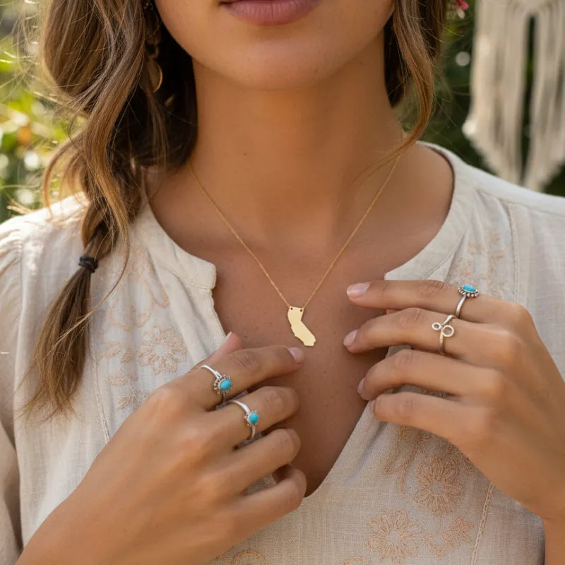 Gold California state pendant necklace with dainty design