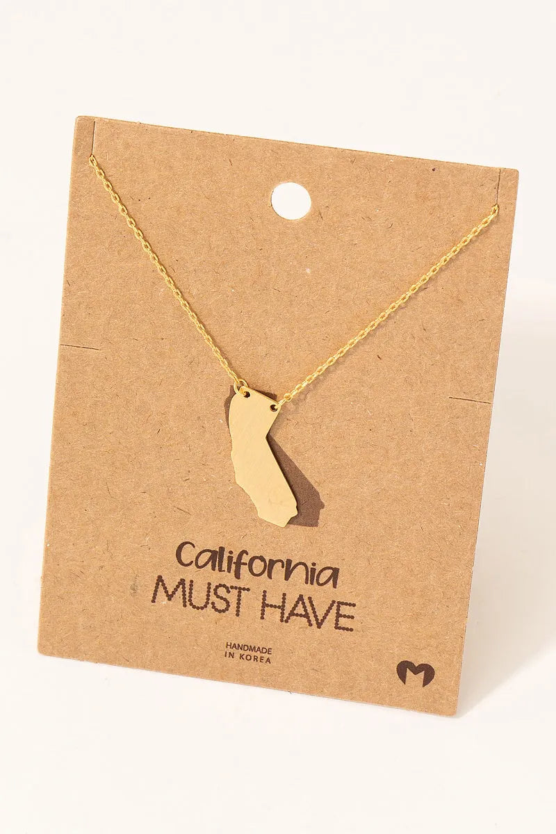 Gold California state pendant dainty necklace on brown card
