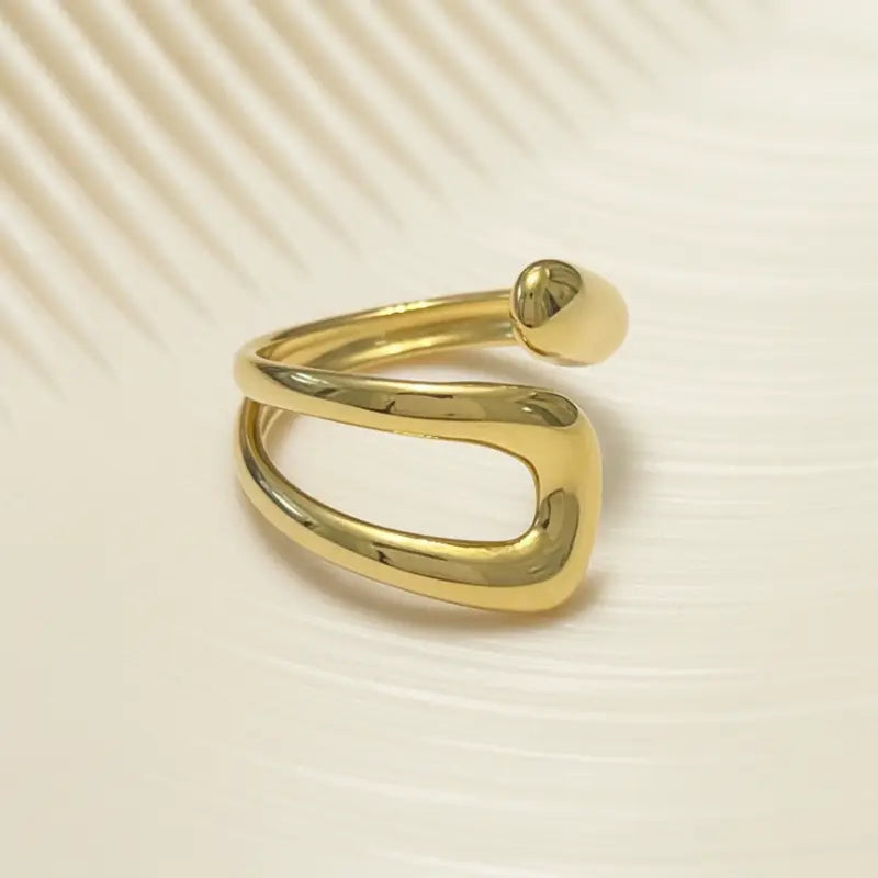 Bohemian gold organic open ring featuring a gold open ring with intertwined bands and a smooth rounded ball end
