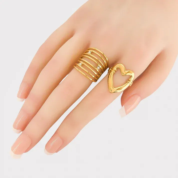 Gold cutout heart design ring with hollow style and small stones