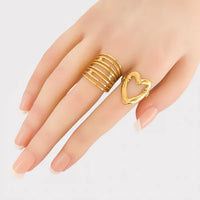 Gold cutout heart design ring with hollow style and small stones