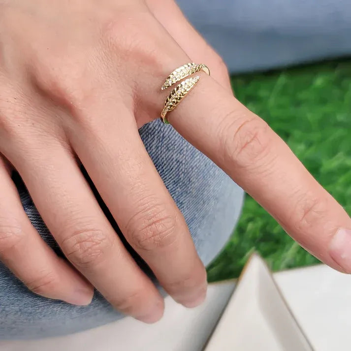 Open front feather ring gold with leaf shape, intricate details, sparkling stones