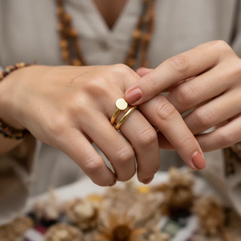 Gold coil nail ring featuring a smooth circular disc accent in polished gold for elegant everyday wear